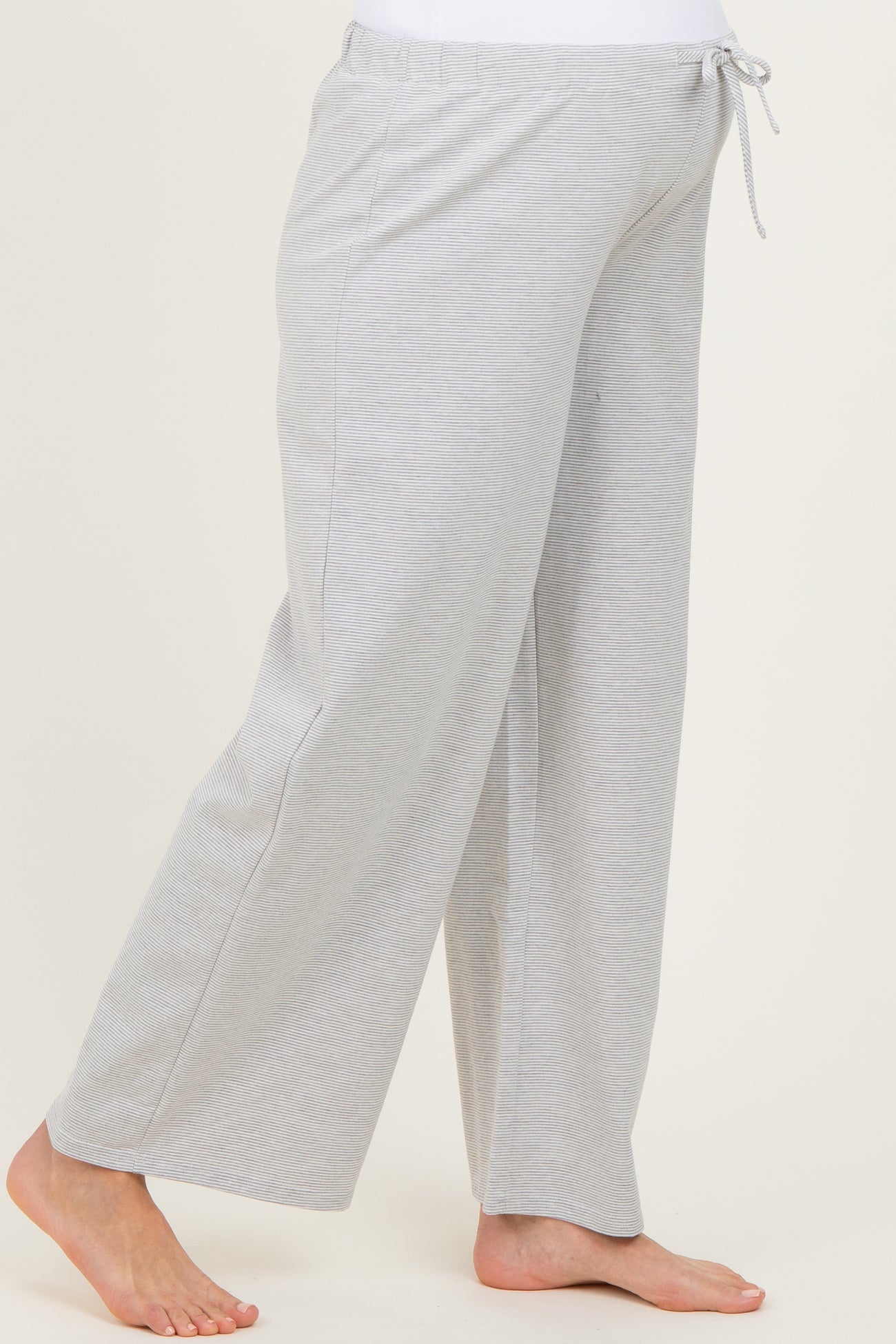 maternity wear gray wide-leg pants with an adjustable drawstring waist and a relaxed fit, model showing a baby bump