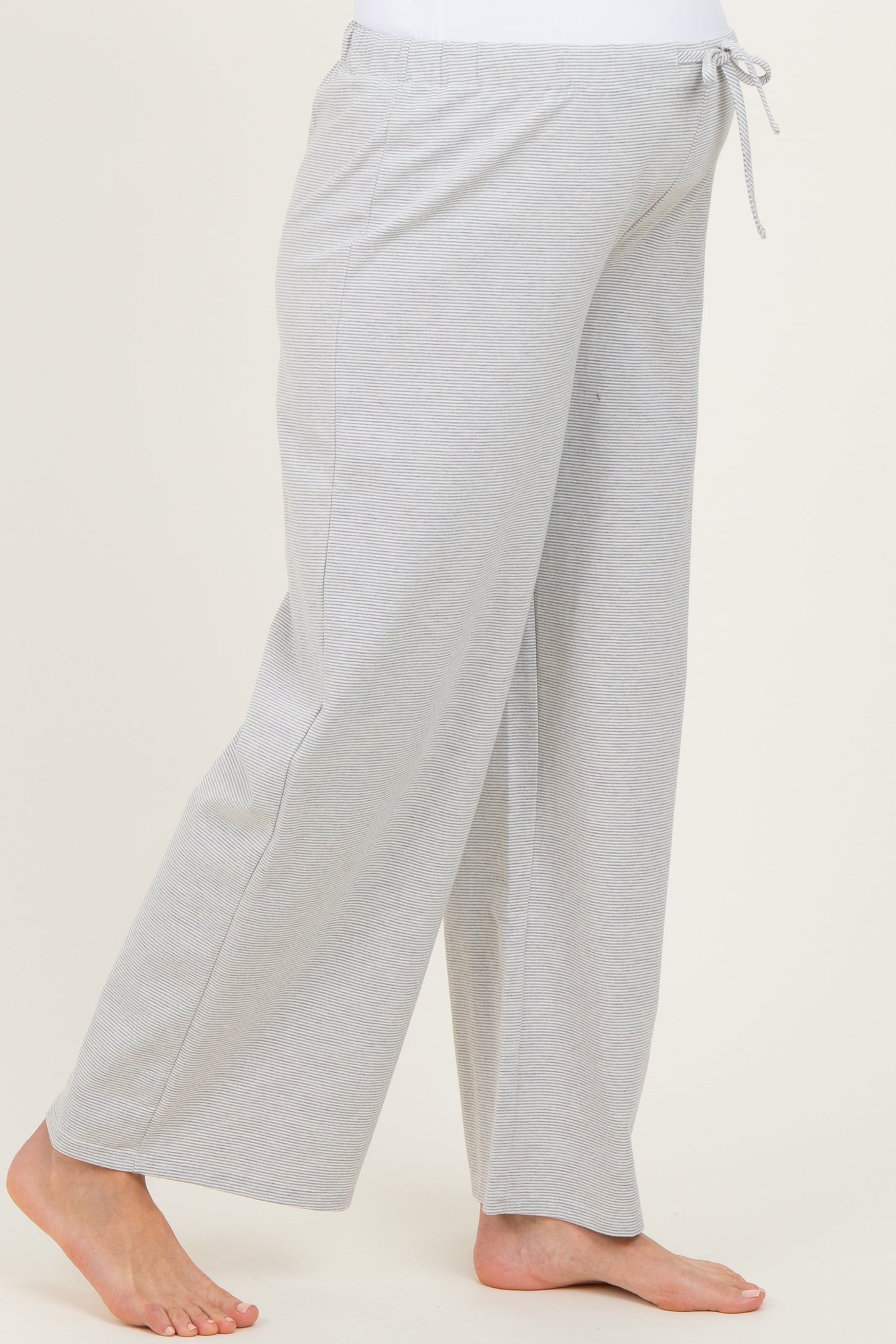 maternity wear gray wide-leg pants with an adjustable drawstring waist and a relaxed fit, model showing a baby bump