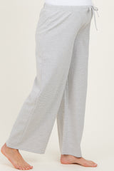 maternity wear gray wide-leg pants with an adjustable drawstring waist and a relaxed fit, model showing a baby bump