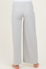 woman wearing light gray maternity lounge pants, shown from the back