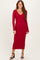 woman wearing a red ribbed long sleeve midi dress with a v-neckline and fitted silhouette