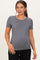 woman wearing a gray short sleeve maternity top with a visible baby bump