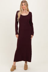 woman wearing a burgundy ribbed long sleeve maxi dress and tan clogs