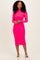 woman wearing a bright pink long sleeve bodycon dress with a high neck and sheer overlay