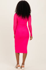 woman wearing a long sleeve hot pink fitted midi dress with a bodycon silhouette