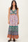 woman wearing a floral print maxi dress with a deep V-neckline and colorful tiered hem