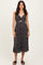 woman wearing a black floral print midi dress with a front cutout and spaghetti straps