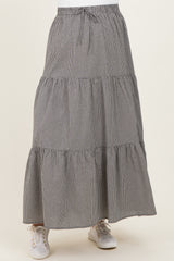 maternity wear black and white gingham tiered maxi skirt with an elastic waistband and sneakers