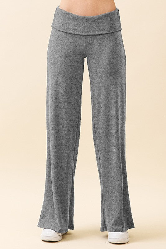 woman wearing gray wide-leg lounge pants with a foldover waistband