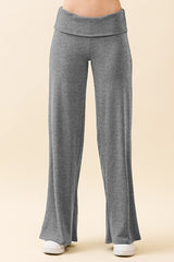 woman wearing gray wide-leg lounge pants with a foldover waistband