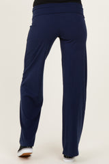 woman wearing navy blue maternity pants viewed from the back