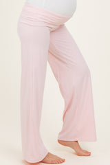 maternity wear light pink wide-leg maternity pants with a stretchy waistband and a visible baby bump
