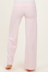 maternity wear light pink wide-leg pants shown from the back