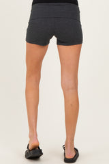 woman wearing black maternity shorts, showing back view of the shorts and legs