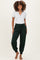 woman wearing a gray short sleeve maternity top and green jogger pants with a relaxed fit and elastic waistband, no baby bump visible
