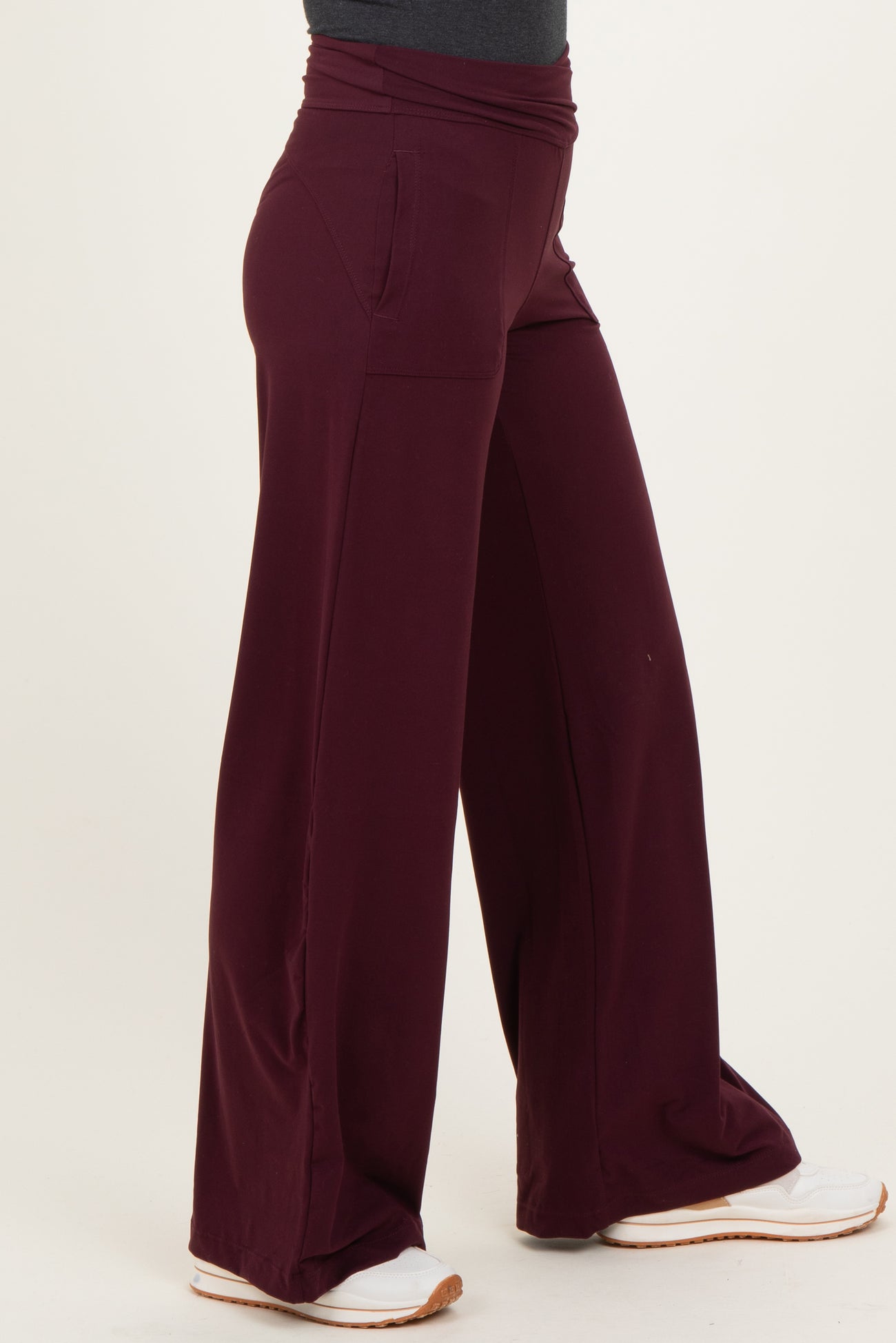 woman wearing burgundy wide-leg lounge pants with side pockets