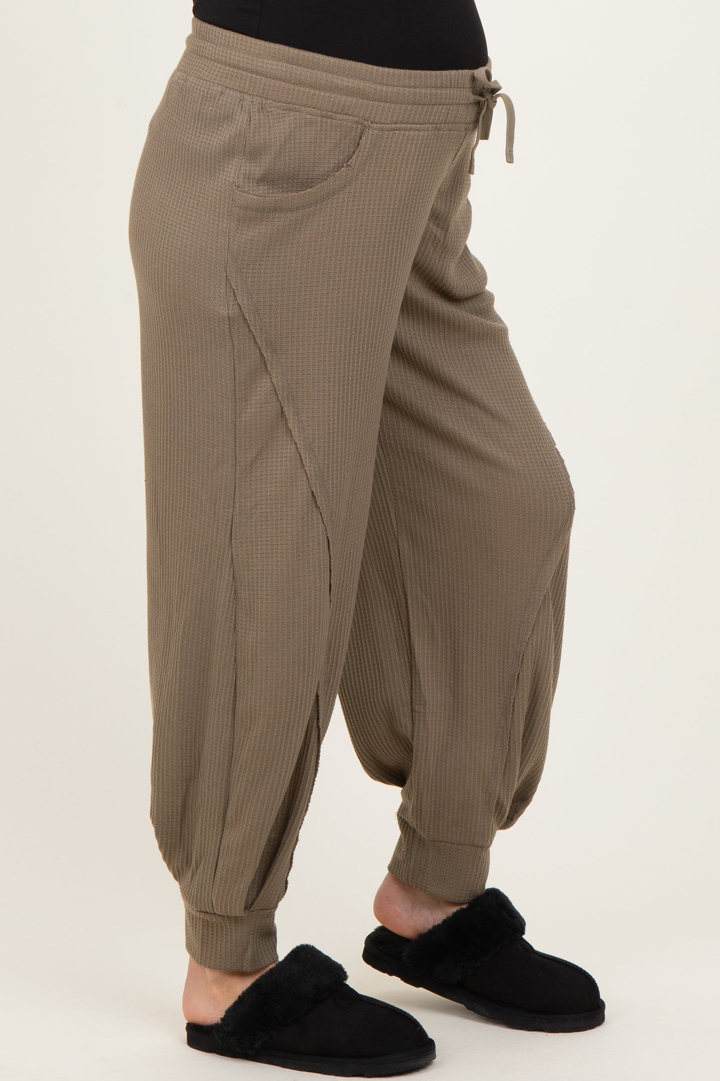 maternity wear in olive green ribbed jogger pants with side pockets and gathered cuffs