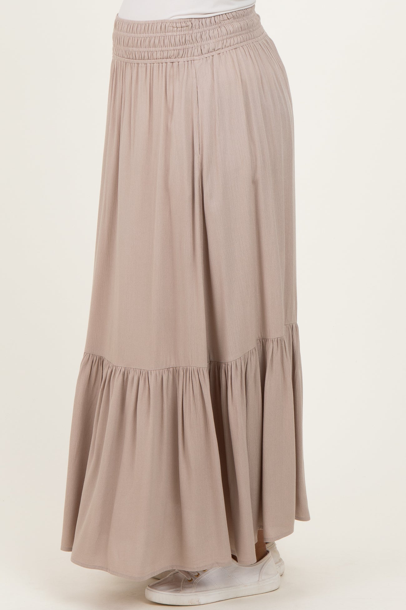 maternity wear light pink tiered maxi skirt with an elastic waistband, styled with a relaxed fit