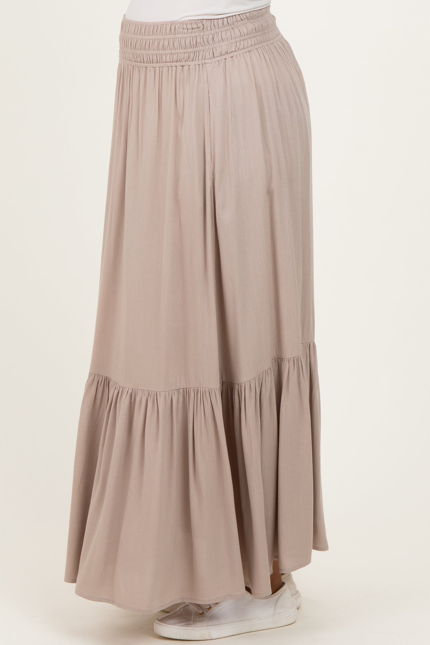 maternity wear light pink tiered maxi skirt with an elastic waistband, styled with a relaxed fit