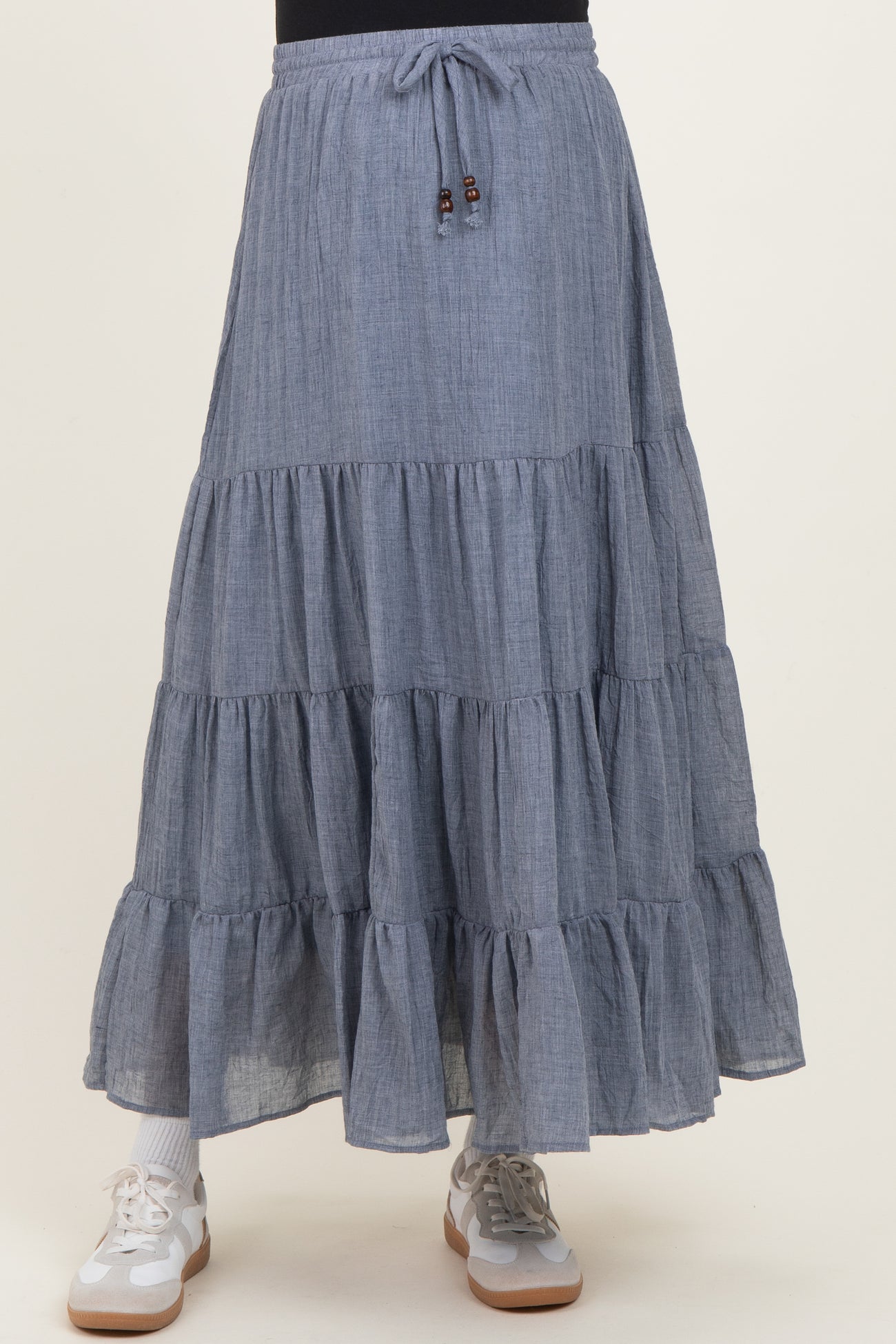 maternity wear grey tiered maxi skirt with drawstring waist and model wearing sneakers