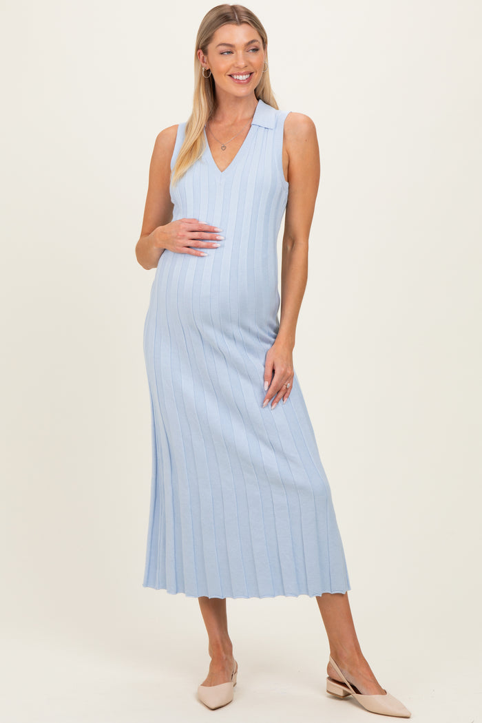 woman wearing a light blue ribbed maternity dress with a v-neck and a visible baby bump