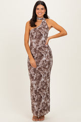 woman wearing a brown and beige one-shoulder maxi dress with a matching neck scarf