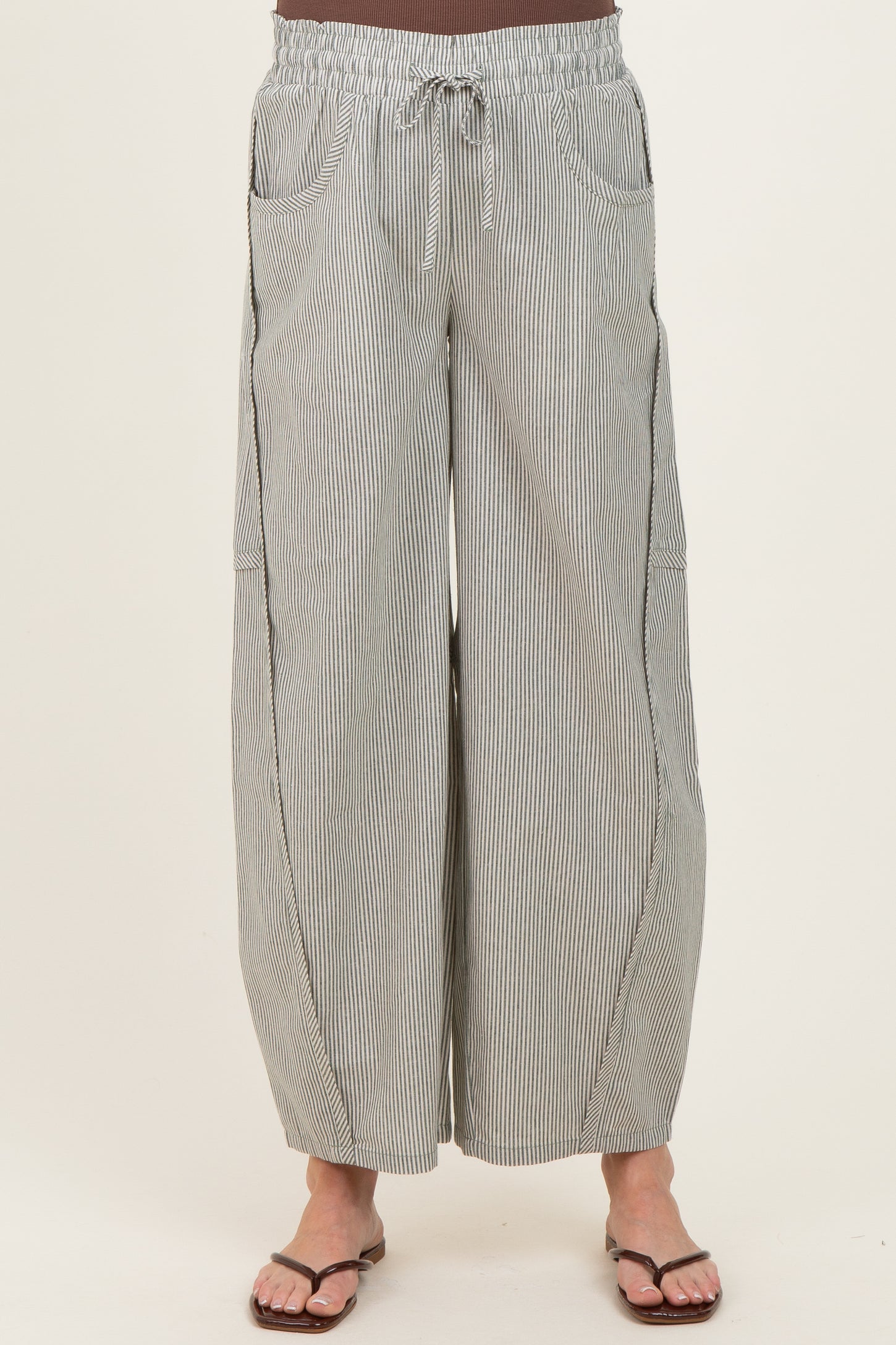 woman wearing striped wide-leg maternity pants with an elastic waistband and side pockets