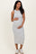 woman wearing a gray and white striped maternity dress and holding her baby bump
