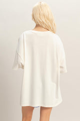 woman wearing an oversized white t-shirt viewed from the back
