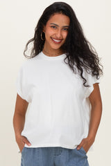 woman wearing a white oversized maternity t-shirt with short sleeves and relaxed fit