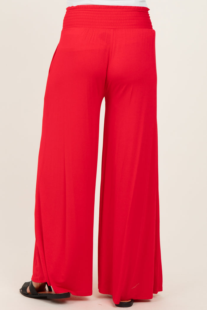 red wide-leg maternity pants with a stretchy waistband, viewed from the back