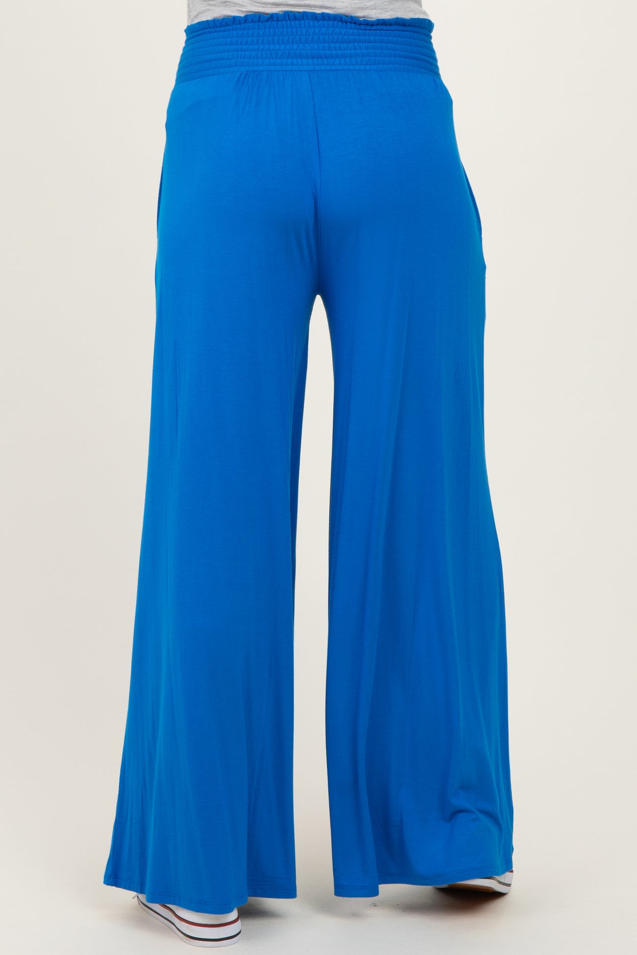 maternity wear wide leg blue pants with an elastic waistband, shown from the back
