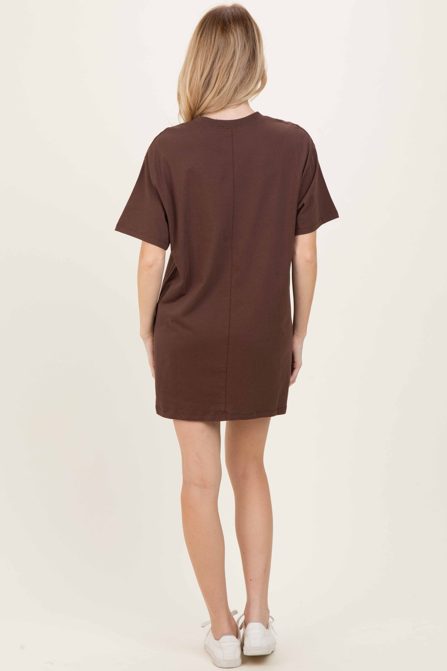 woman wearing a brown short sleeve casual dress, shown from the back, with a relaxed fit and above-the-knee length