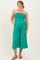 woman wearing a teal strapless maternity jumpsuit with wide legs and pockets, showing a visible baby bump