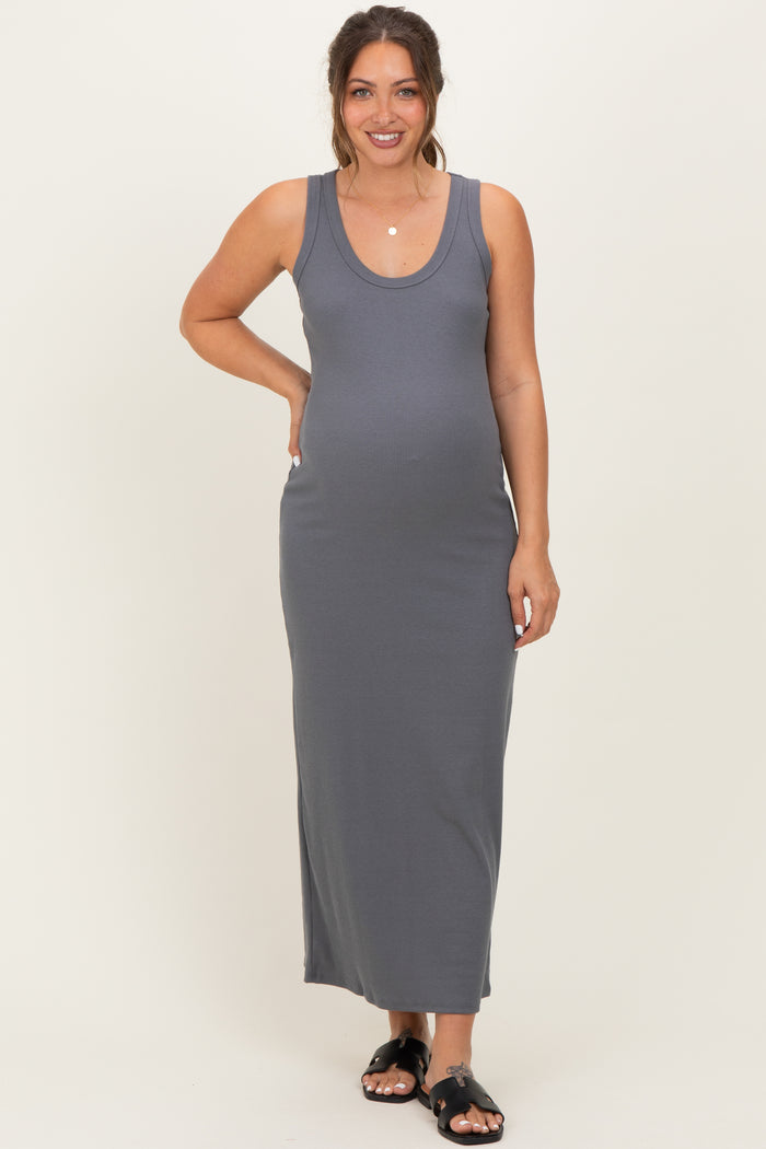woman wearing a grey ribbed maxi maternity dress and showing her baby bump