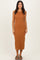 woman wearing a sleeveless brown midi dress with a fitted silhouette and sandals