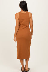 woman wearing a rust brown midi tank dress, shown from the back, form-fitting ribbed fabric