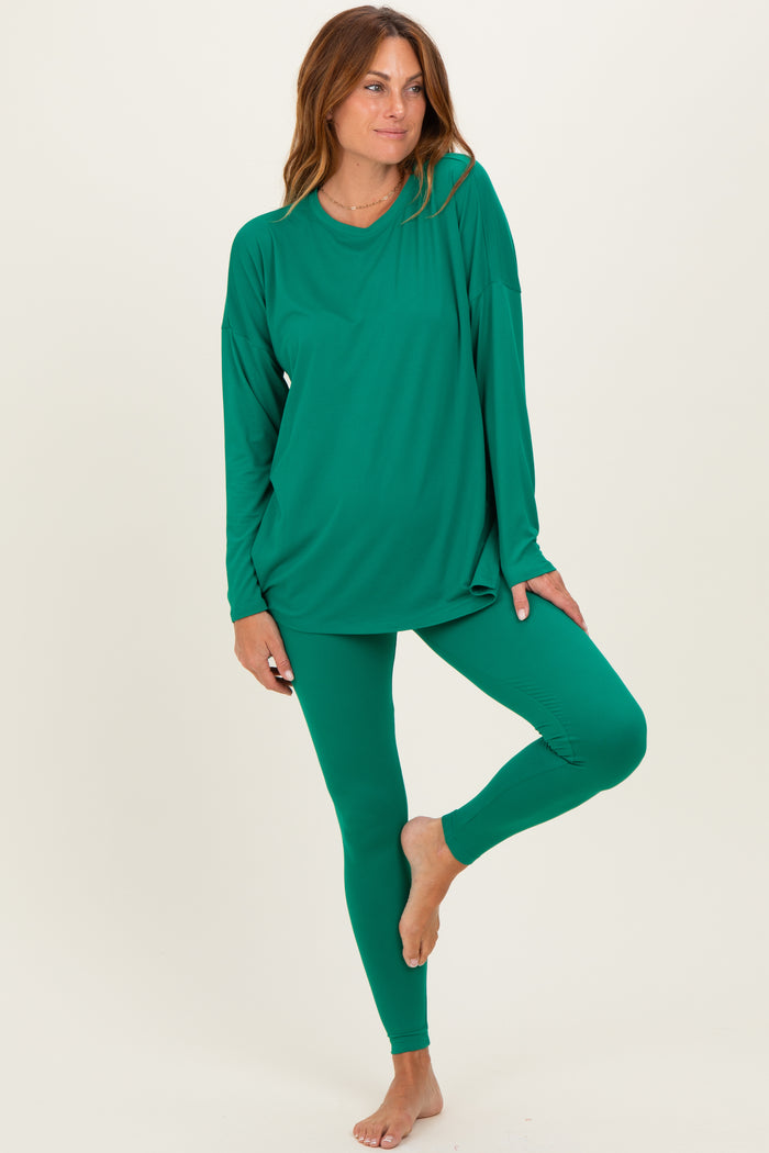 woman wearing a long sleeve green top and matching green leggings in a relaxed fit
