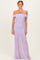 woman wearing a lavender off-the-shoulder ruched maxi dress with a flowing lower skirt