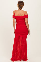 woman wearing a red off-the-shoulder maxi dress with fitted bodice and flowing skirt from the back