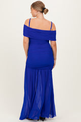 woman wearing a royal blue off-the-shoulder maternity dress with ruched details and a flowy skirt, showing a baby bump