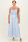woman wearing a light blue smocked maxi dress with spaghetti straps and a flowy skirt