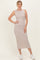 woman wearing a striped beige and white midi dress with a fitted silhouette and simple neckline