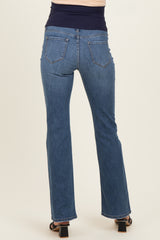 woman wearing dark wash maternity jeans, viewed from the back, showing straight leg and elastic waistband