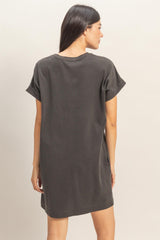 woman wearing a dark grey oversized t-shirt dress, viewed from the back with short sleeves