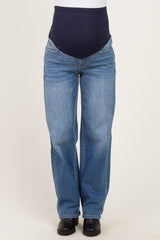 maternity wear featuring a woman in blue denim maternity jeans with a dark blue over-the-bump band