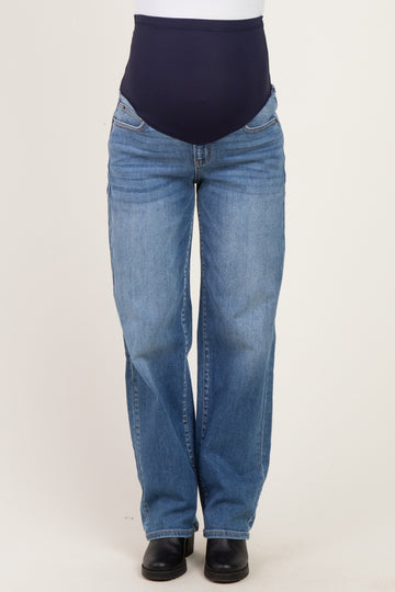maternity wear featuring a woman in blue denim maternity jeans with a dark blue over-the-bump band