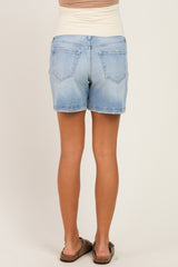 woman wearing light blue maternity shorts with a stretchy waistband, viewed from the back