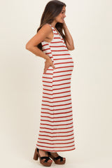 woman wearing a red and white striped maternity maxi dress highlighting her baby bump
