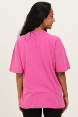 woman wearing a pink oversized maternity t-shirt, shown from the back with short sleeves and a relaxed fit